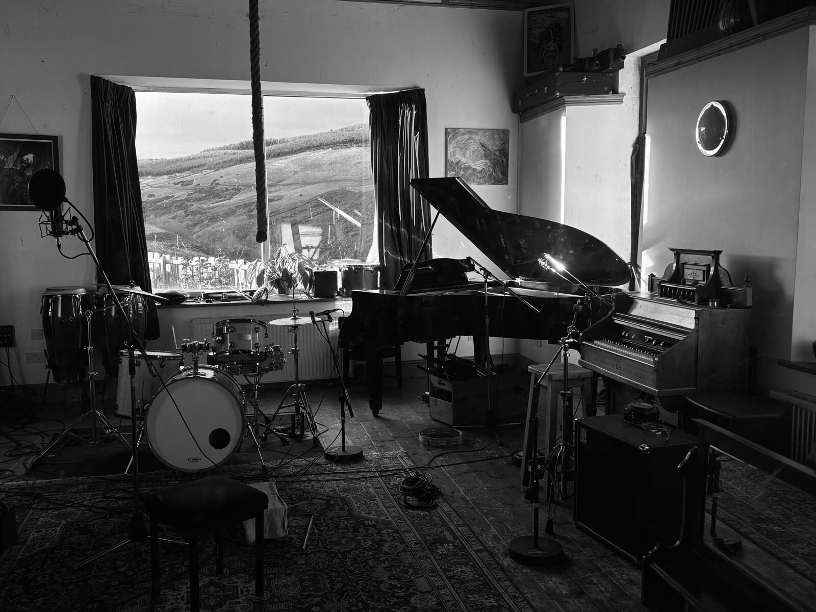 The live room at TPot Recording Studios — grand piano, drums, organ and the Perthshire hills through the window